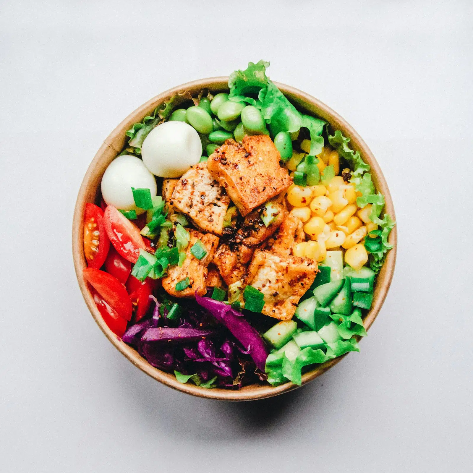 Fresh green Buddha bowl with colorful vegetables